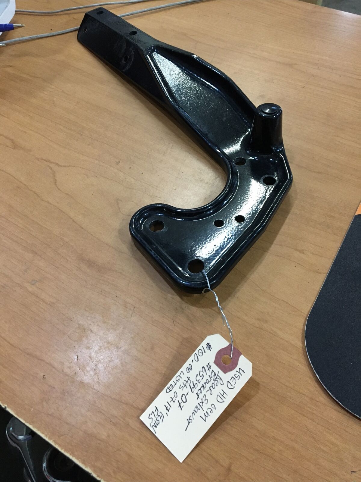 Harley Davidson OEM Rear exhaust bracket #65399-07